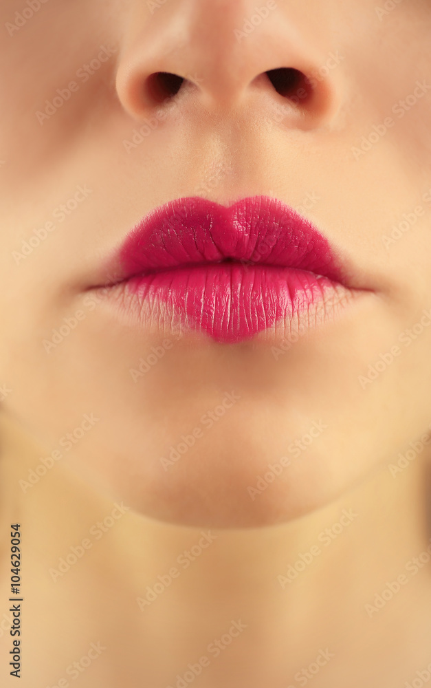 Fototapeta premium Sexy lips with purple heart shape paint, closeup