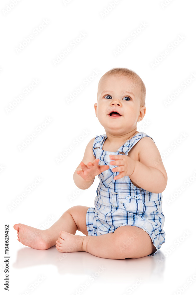 Baby is sitting on floor, isolated on white Baby is sitting on floor, isolated on white