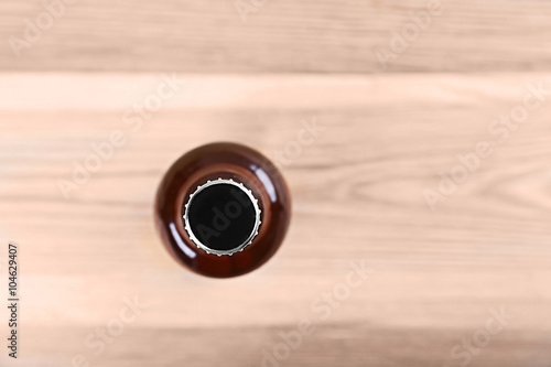 Beer bottle on wooden table
