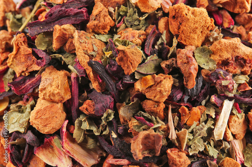 Mix of dry tea, fruits and flower petals, close up