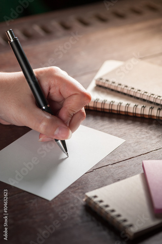 Wallpaper Mural Female hand writing on paper Torontodigital.ca