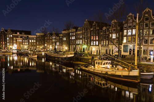 View along the Waalseilandgracht Canal in Amsterdam at night