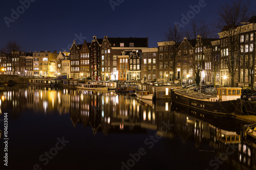 View along the Waalseilandgracht Canal in Amsterdam at night © mikecleggphoto