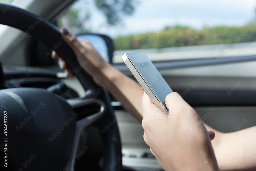 woman driver using a smart phone in car woman driver using a smart phone in car