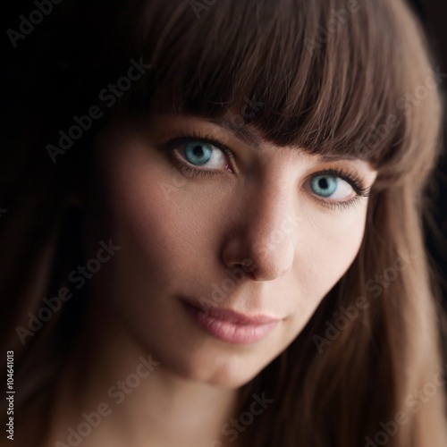 face woman with blue eyes dark hair