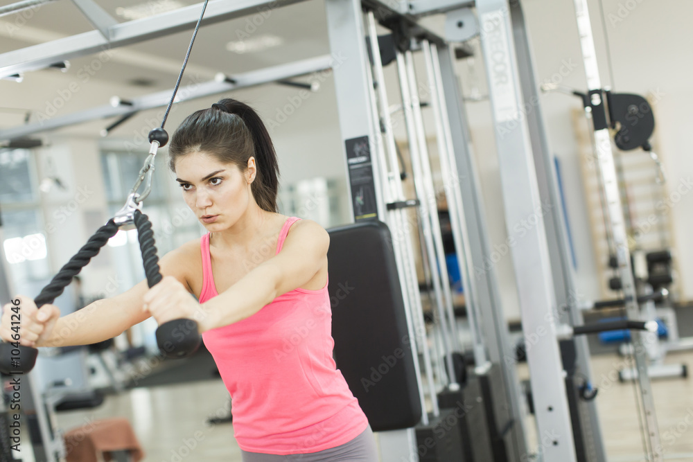 Pretty young woman training in the gym Pretty young woman training in the gym