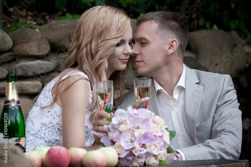 blond bride and groom in nature