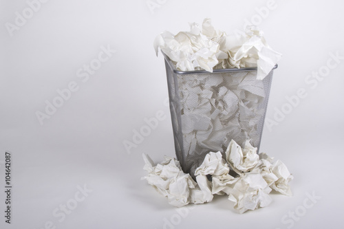 A Waste Bin With Screwed Up Paper Balls