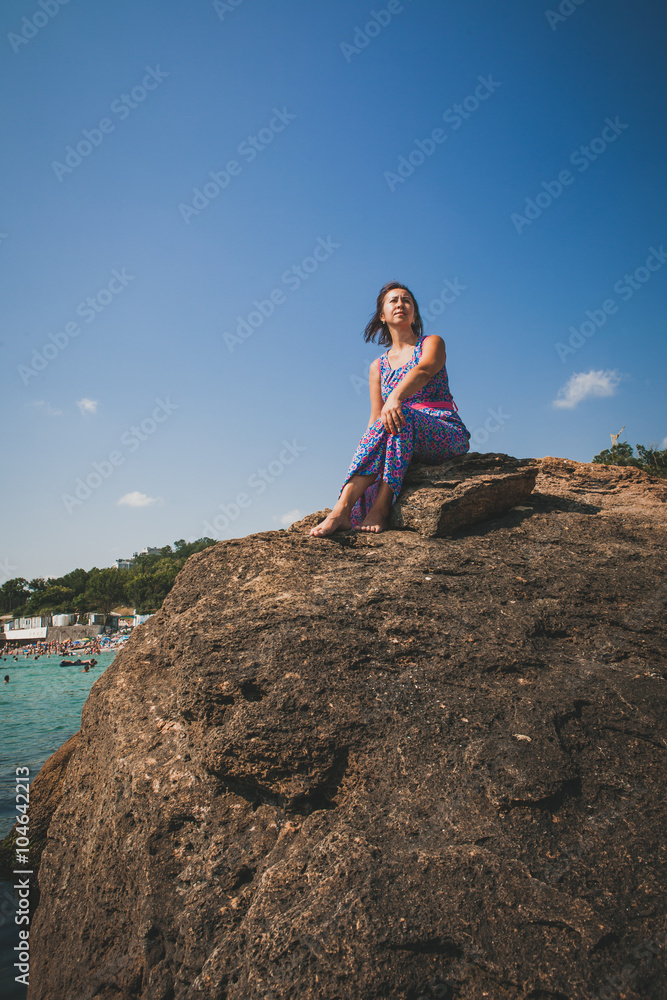 Beautiful woman rock near the ocean