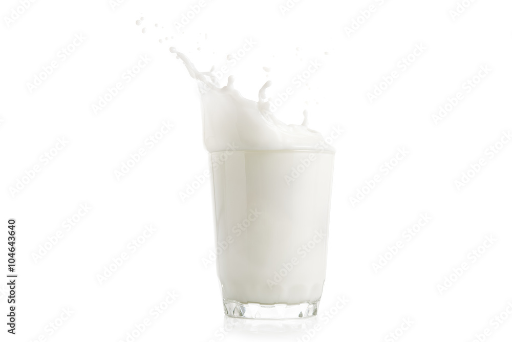 Splash of milk in glass isolated Splash of milk in glass isolated