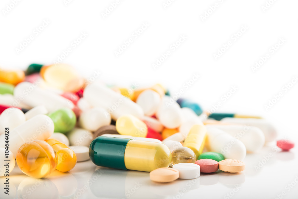 Medical concept of green capsule pills isolated Medical concept of green capsule pills isolated