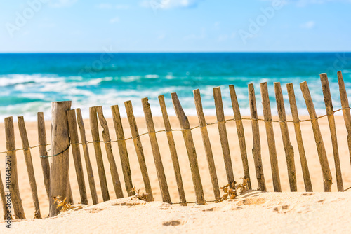 Wooden fence on an Atlantic beach in France