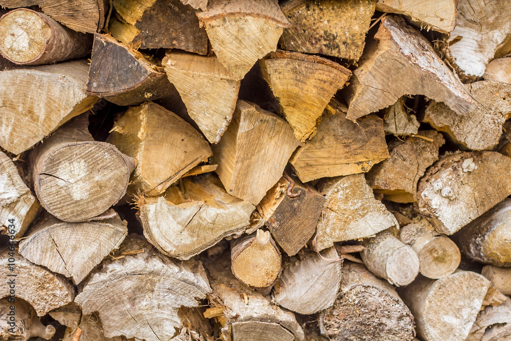 Fototapeta premium A stack of split logs being dried for firewood