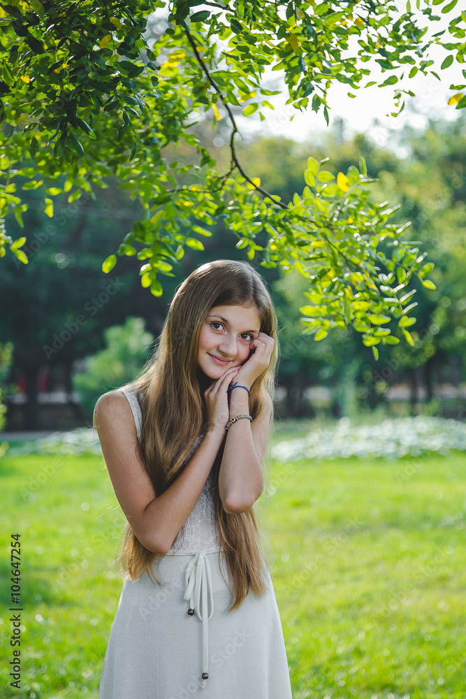 Young girl in a summer park