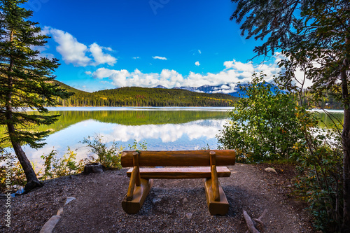 On the shore of lake - wooden benches Fototapet