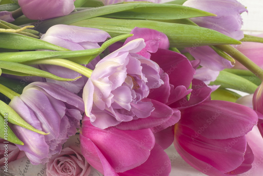 Purple tulips over wooden table. Purple tulips over wooden table.