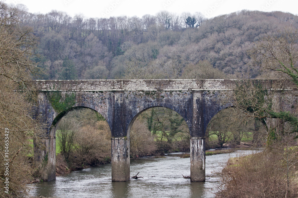 Old stone bridge over the river Torridge in Devon, England