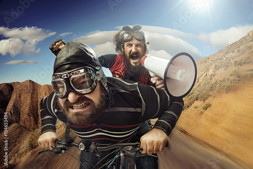 Funny portrait of a tandem of cyclists