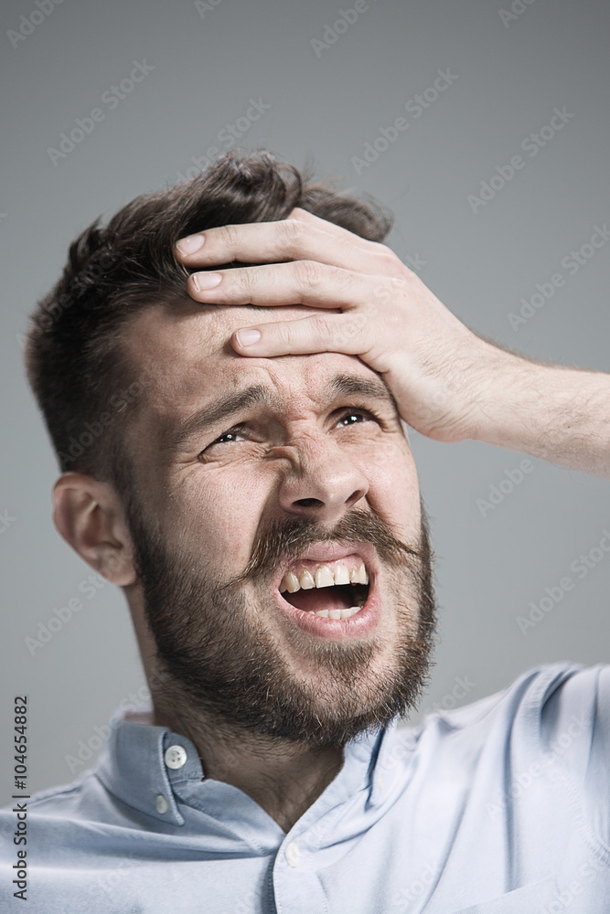 Obraz premium Close up face of desperate man 