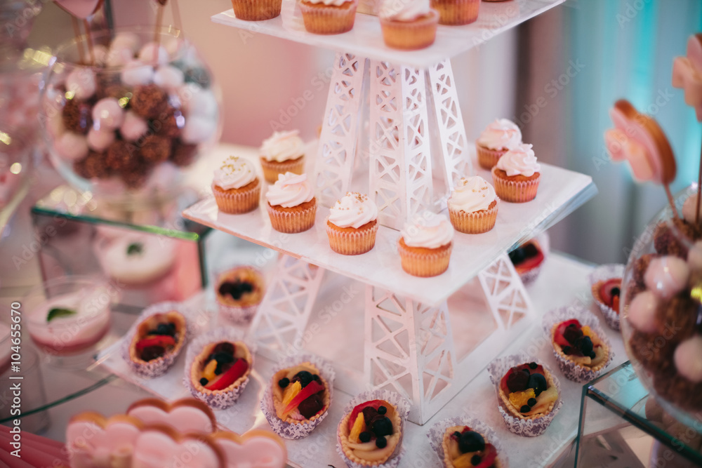 Naklejka premium Different delicious desserts and cakes on the buffet table