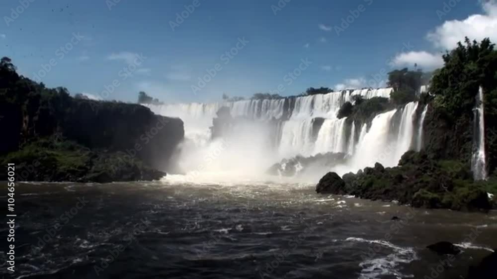 Iguazu semicircular Falls National Park on border of Brazil and Argentina. Made up of many cascades producing vast sprays of water. Iguacu most spectacular waterfalls in world. Natural beauty. Iguazu semicircular Falls National Park on border of Brazil and Argentina. Made up of many cascades producing vast sprays of water. Iguacu most spectacular waterfalls in world. Natural beauty.