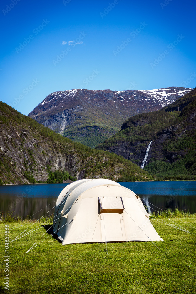Tourist tent on the shore of the lake.
