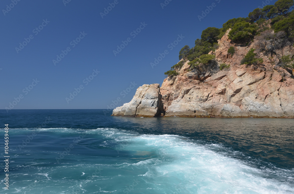 Rock with sea, blue sky and water
