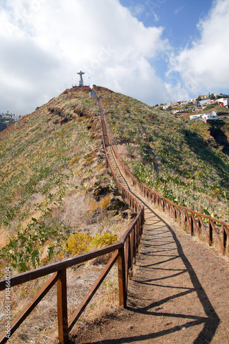 Dust path to the Jesus Christ statue on the top of the hill

