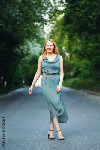 Young Woman Dancing on the Road