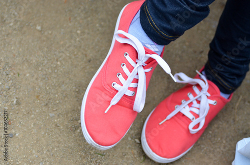 Pink Sneakers with White Shoelaces
