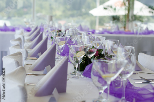 Wedding Table Setup with Flower, cloth napkins and glasses
