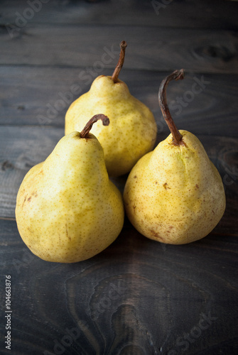 Three fresh yellow pears