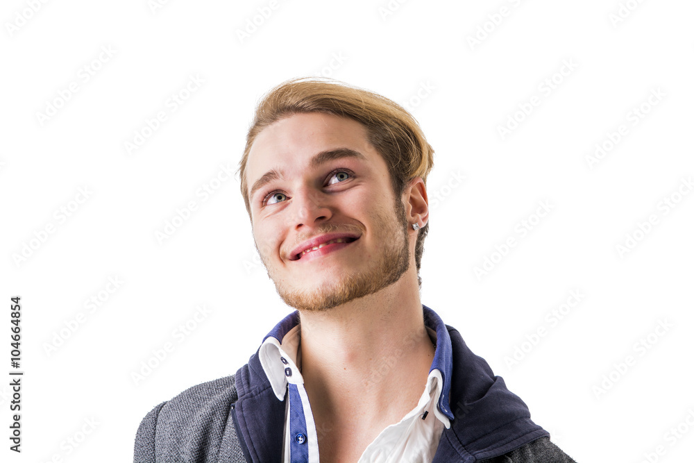 Attractive young man thinking, looking up unsure Attractive young man thinking, looking up unsure