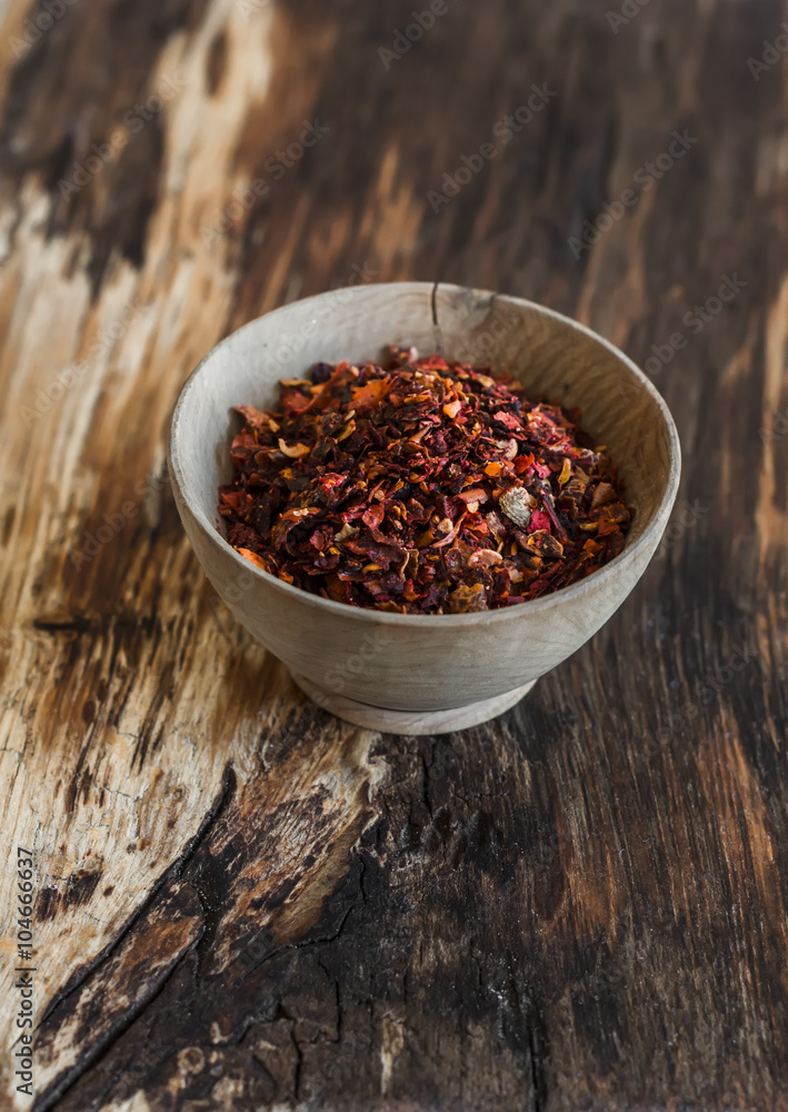 Dry red paprika on a wooden rustic background Dry red paprika on a wooden rustic background