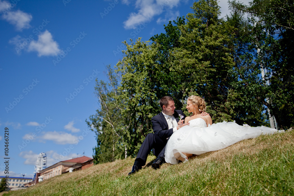 Happy bride and groom at the wedding walk Happy bride and groom at the wedding walk
