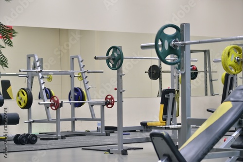 barbellsand athletic bench at the gym