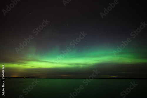 Northern lights over lake in finland