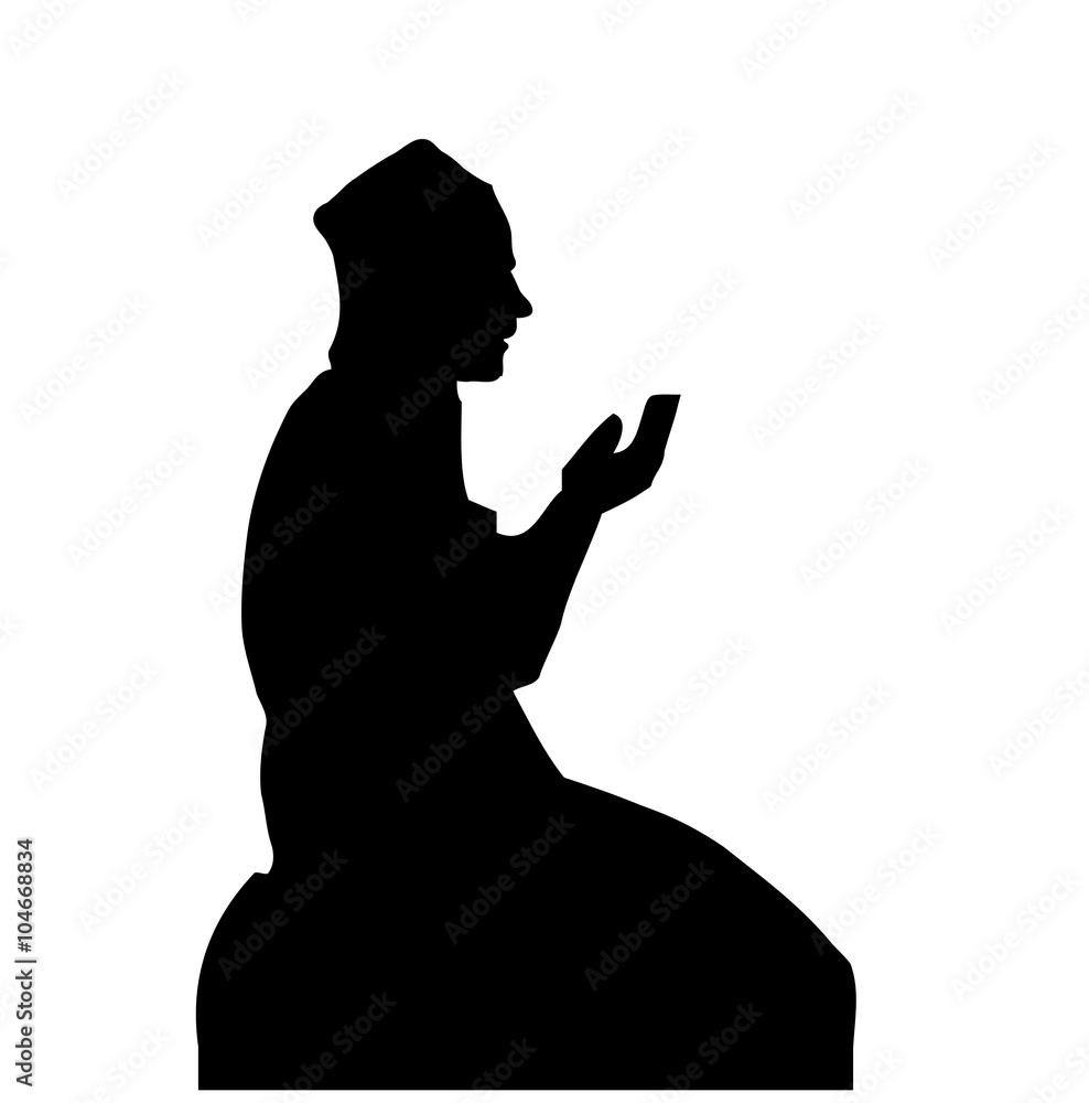 Silhouette of a Muslim praying man