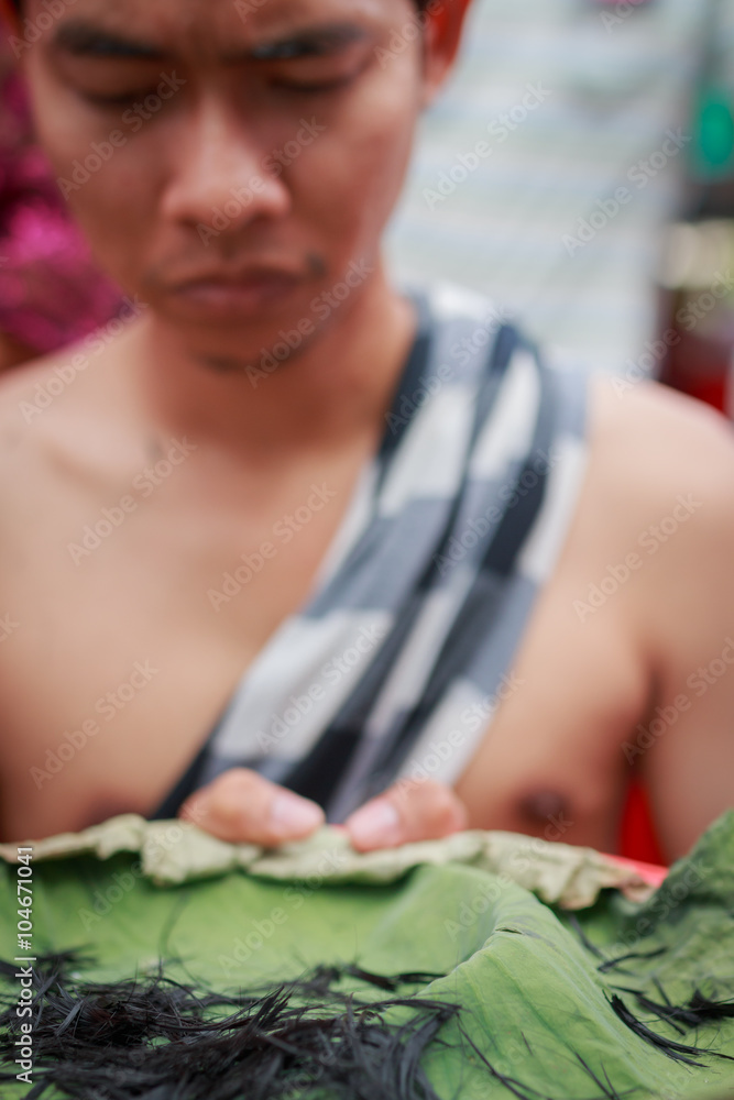 Obraz premium Male who will be monk cut hair for be Ordained.