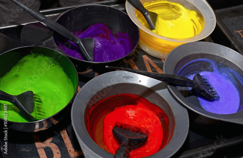 Hair dye in bowls and brush for hair coloring