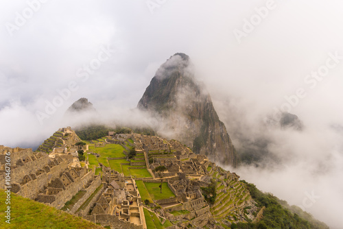 First soft light on Machu Picchu from opening clouds © fabio lamanna