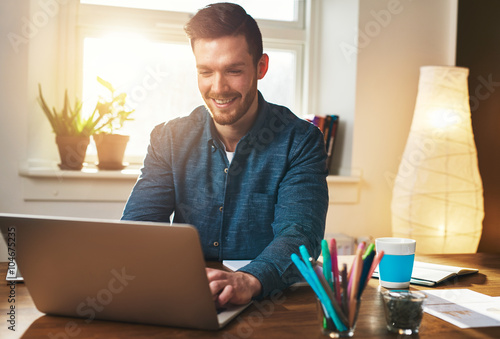 Successful entrepreneur smiling in satisfaction photo