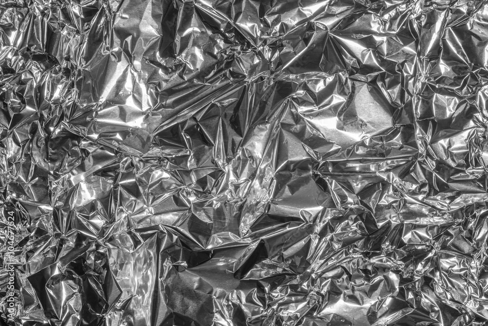 Crumpled silver aluminum foil. View from above. Crumpled silver aluminum foil. View from above.