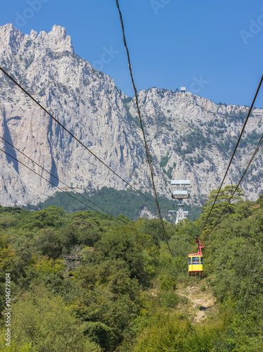 The cable car in Crimea Ai-Petri on a background of mountains covered with clouds
