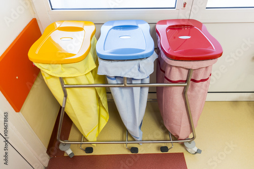 Three recycle bins in a hospital photo