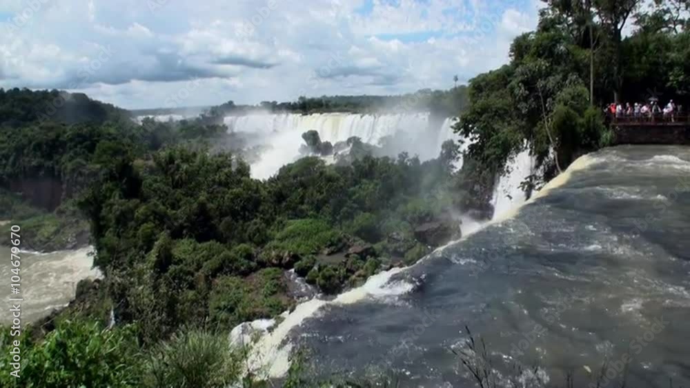 Iguazu semicircular Falls National Park on border of Brazil and Argentina. Made up of many cascades producing vast sprays of water. Iguacu most spectacular waterfalls in world. Natural beauty. Iguazu semicircular Falls National Park on border of Brazil and Argentina. Made up of many cascades producing vast sprays of water. Iguacu most spectacular waterfalls in world. Natural beauty.