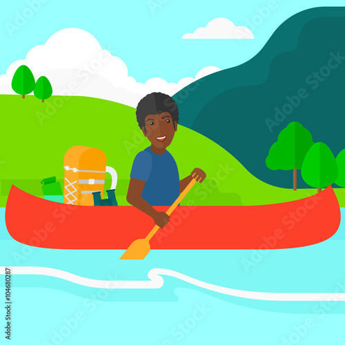 Man canoeing on the river.
