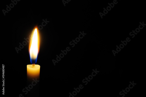 White candle light with black background