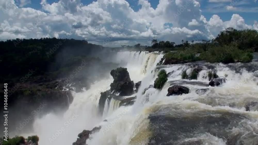 Iguazu semicircular Falls National Park on border of Brazil and Argentina. Made up of many cascades producing vast sprays of water. Iguacu most spectacular waterfalls in world. Natural beauty. Iguazu semicircular Falls National Park on border of Brazil and Argentina. Made up of many cascades producing vast sprays of water. Iguacu most spectacular waterfalls in world. Natural beauty.