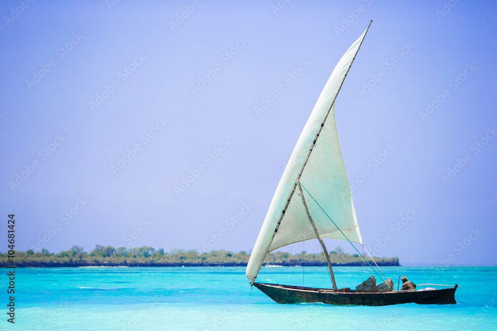 Old wooden dhow in the Indian Ocean near Zanzibar